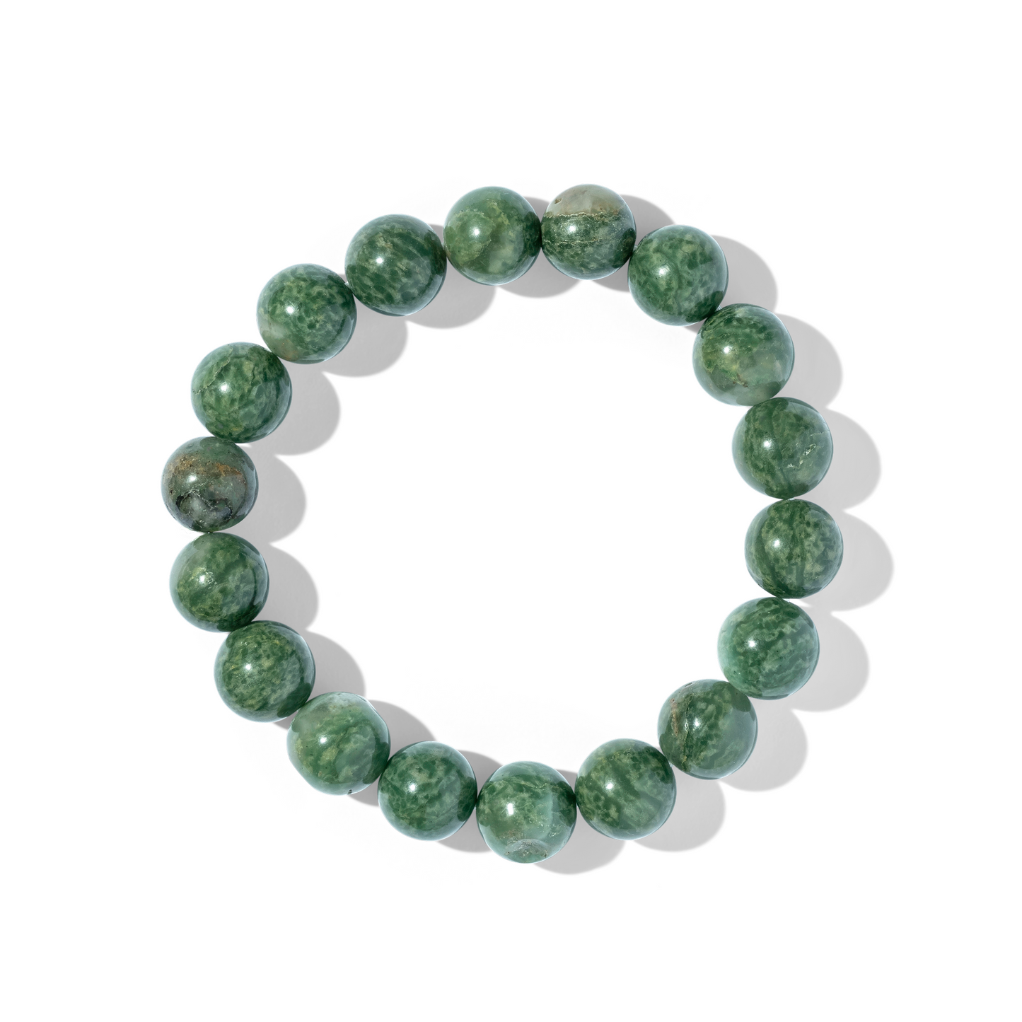 A single crystal gemstone bracelet made of African jasper. An opaque, shiny mottling of moss and light green shades.