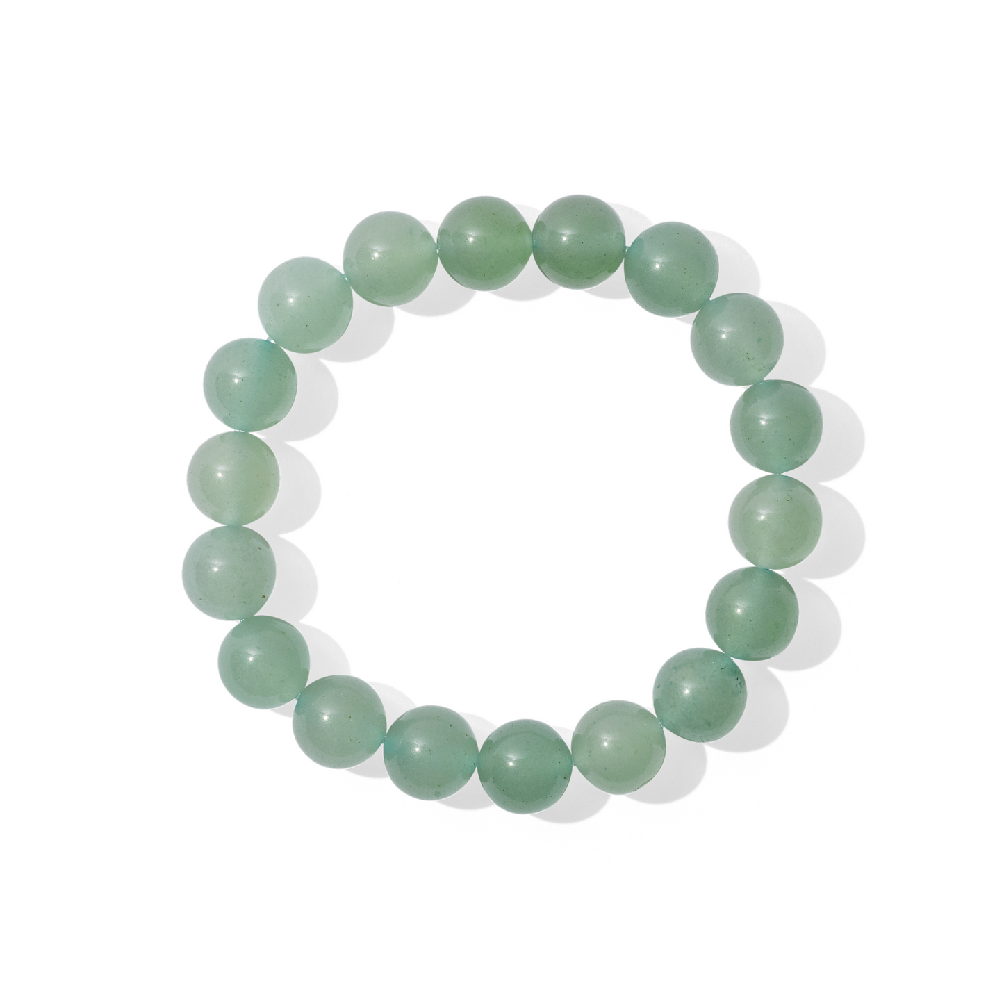 A single crystal gemstone bracelet made of green aventurine quartz. A semi opaque, shiny, mid-toned fresh green.