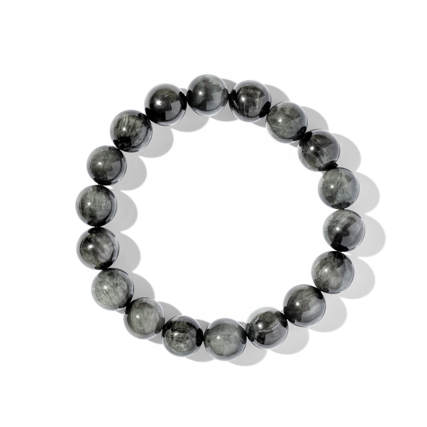 A single crystal gemstone bracelet made of hawk's eye. A shiny mid to dark-toned greys.