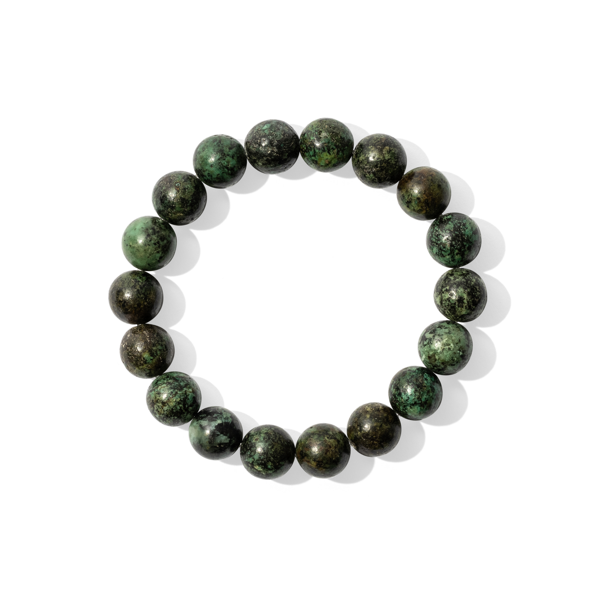 A single crystal gemstone bracelet made of African jasper. Opaque, semi-matte, medium to dark tone green mottled with black.