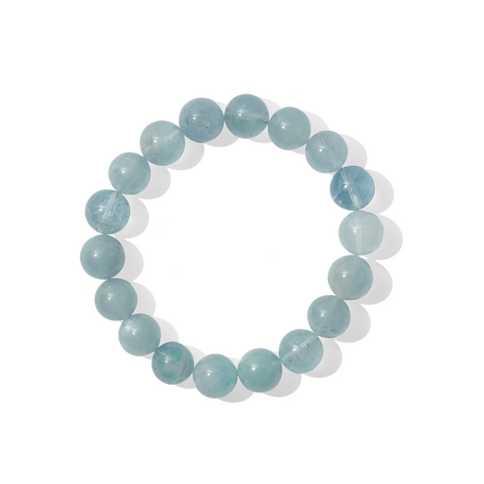 A single crystal gemstone bracelet made of aquamarine. Aquamarine is a semi-transparent, shiny sky-blue.