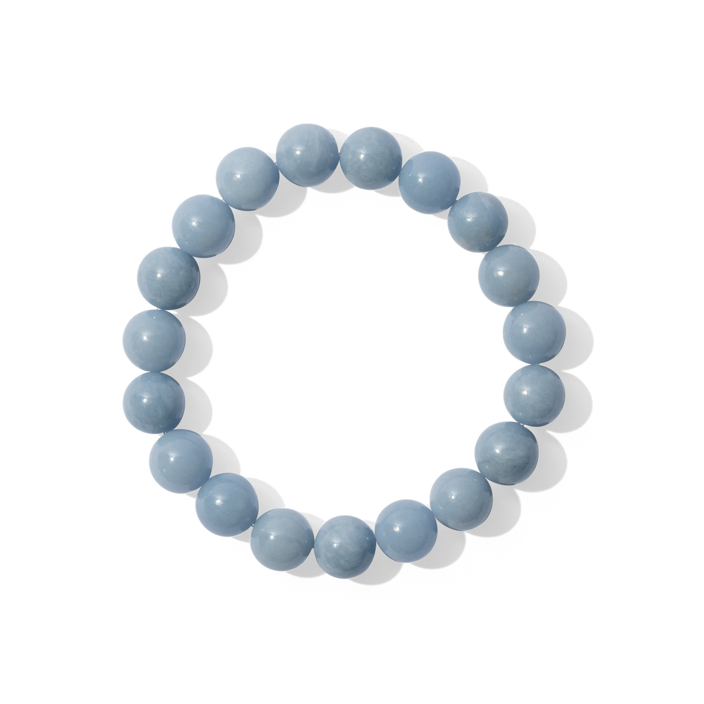 A single crystal gemstone bracelet made of blue angelite. A fully opaque, shiny light blue.