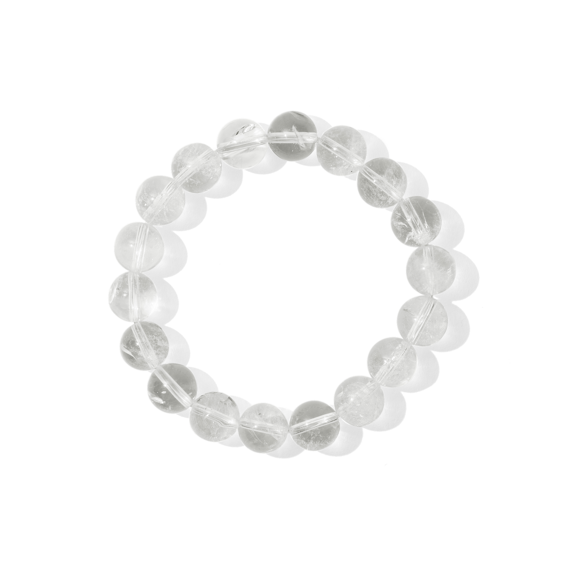 A single crystal gemstone bracelet made of crystal quartz. Fully transparent, shiny, and nearly colourless. 