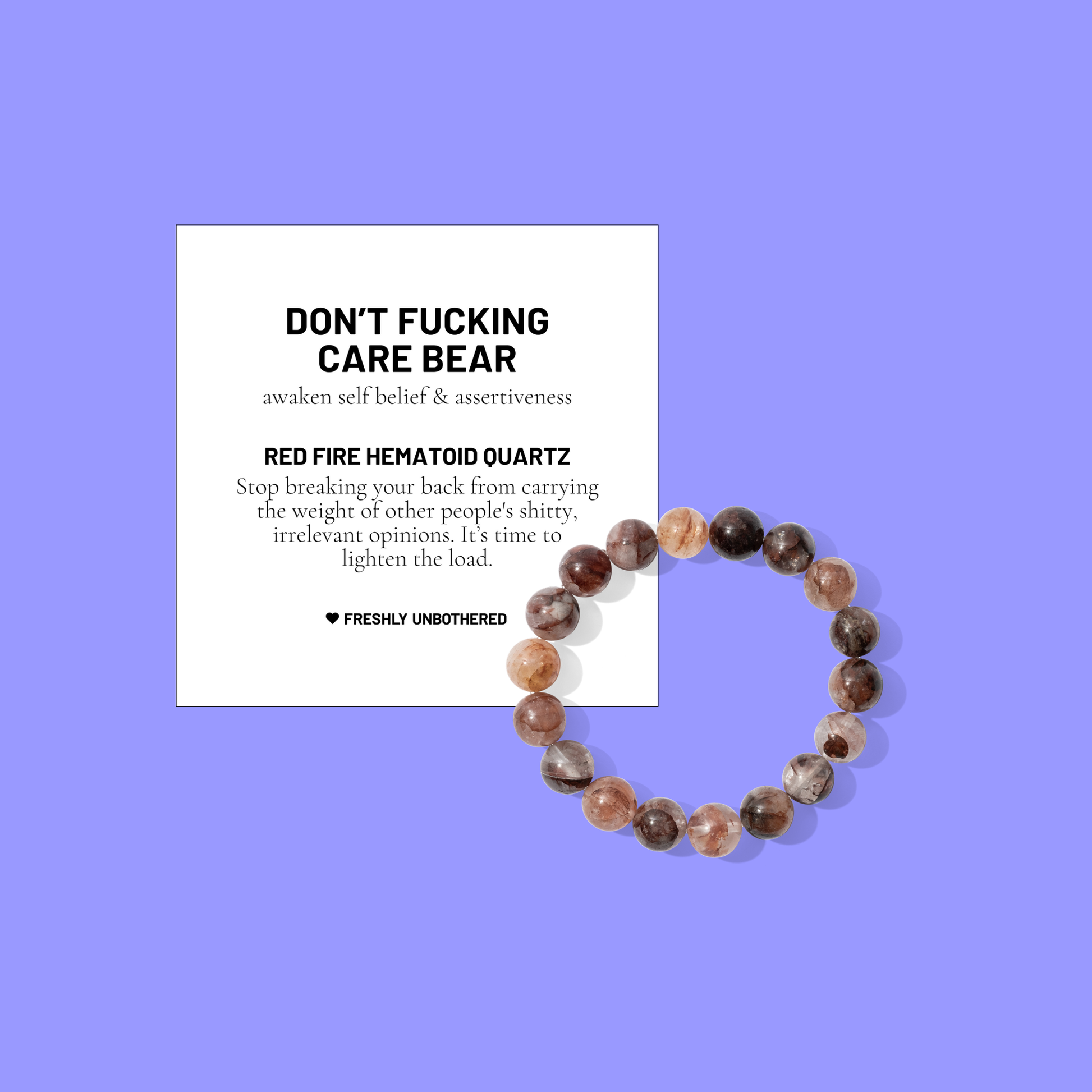 A periwinkle coloured background with a white card bearing the description of a crystal gemstone bracelet, and a round red fire hematoid quartz bead bracelet, positioned below and to the right of the card.