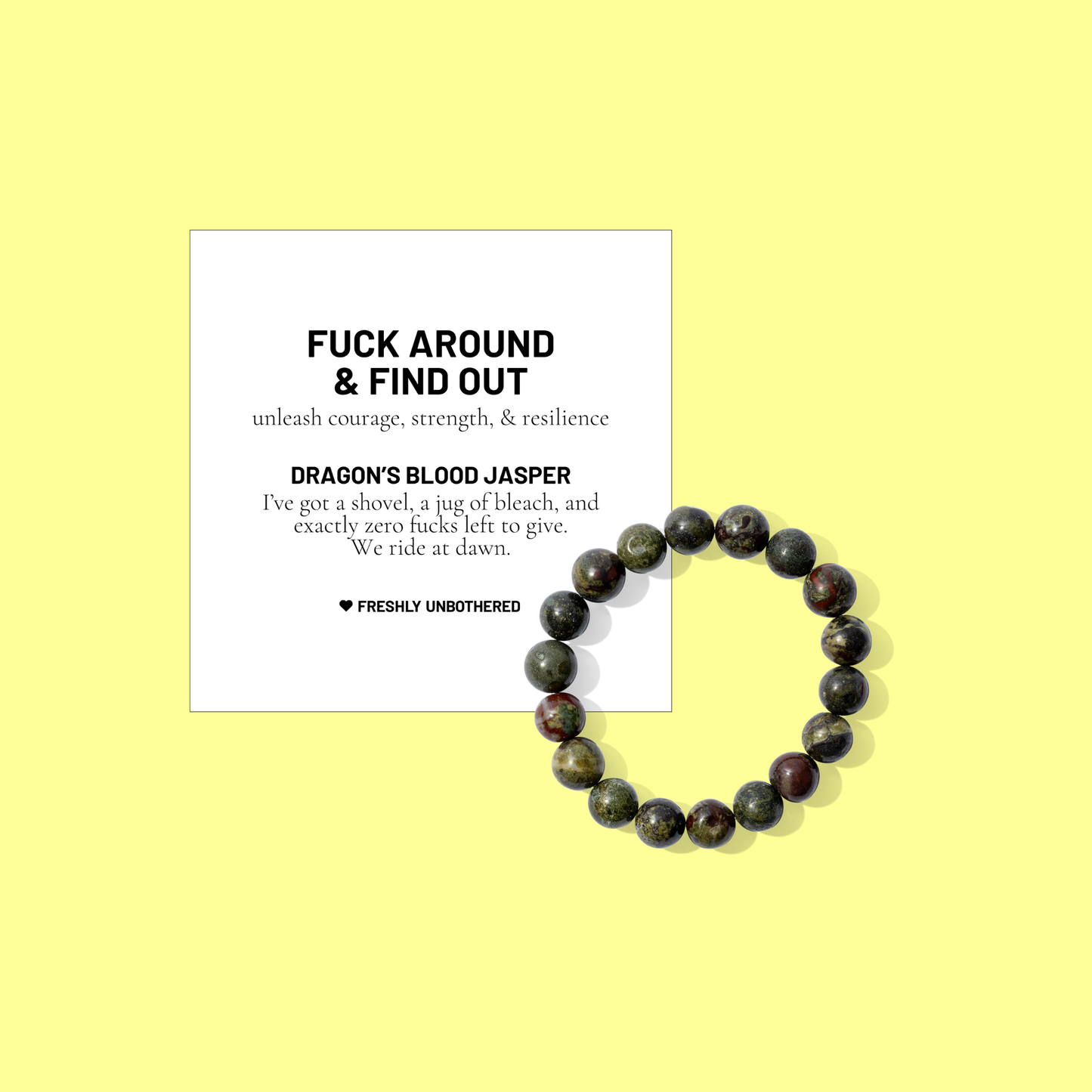 A yellow coloured background with a white card bearing the description of a crystal gemstone bracelet, and a round dragon's blood jasper bead bracelet, positioned below and to the right of the card.