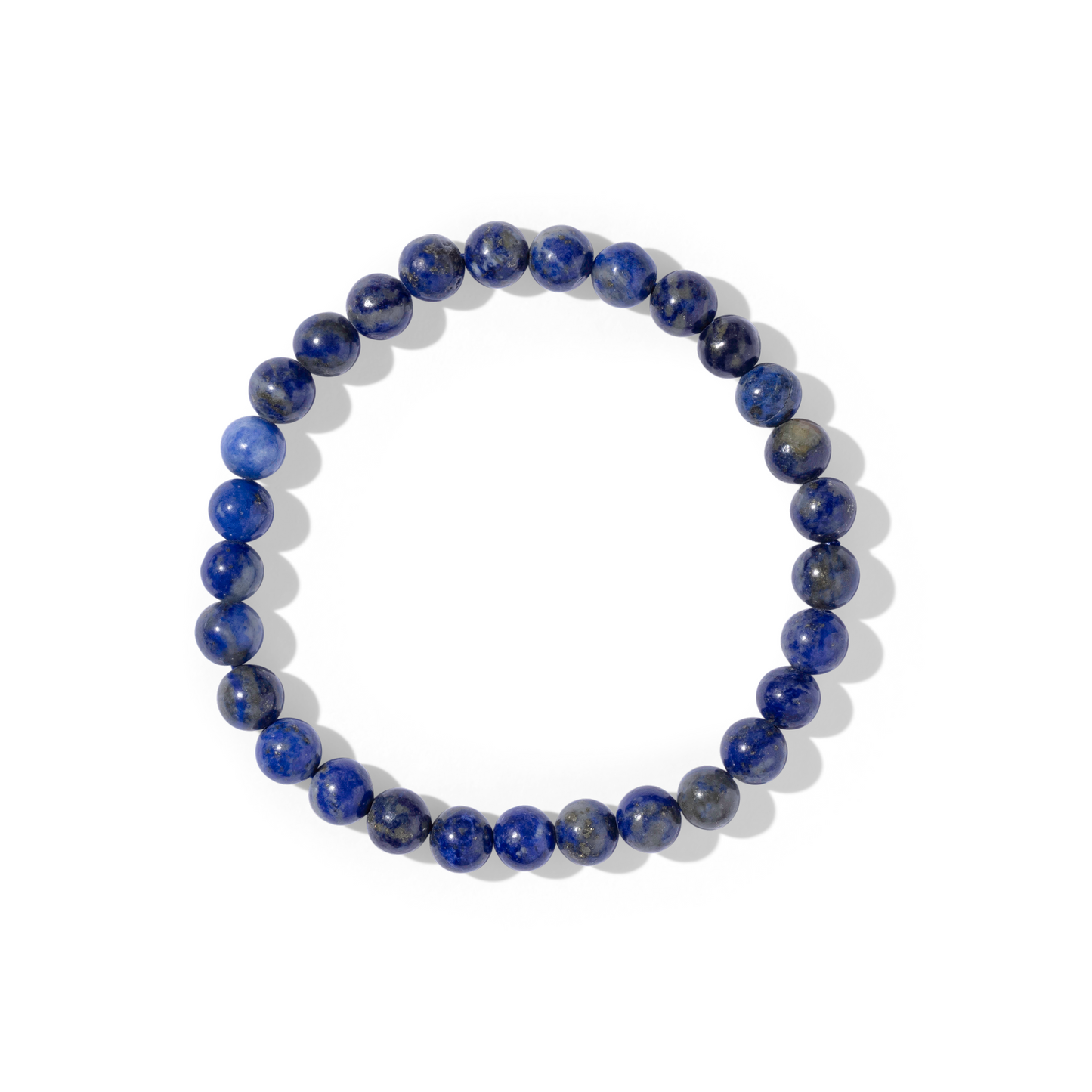 A single crystal gemstone bracelet of lapis lazuli. Lapis lazuli is an opaque, shiny mixture of royal and azure blues with tiny flecks of shimmery gold pyrite.