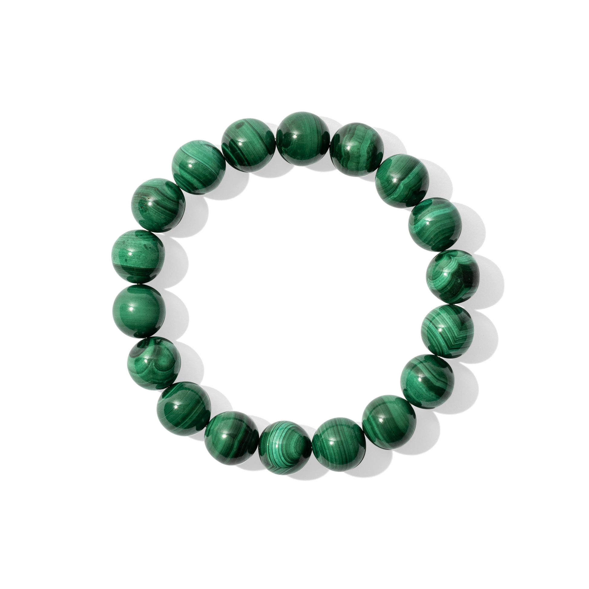 A single crystal gemstone bracelet made of malachite. An opaque, shiny bright green with thin, ultra-dark green banding.