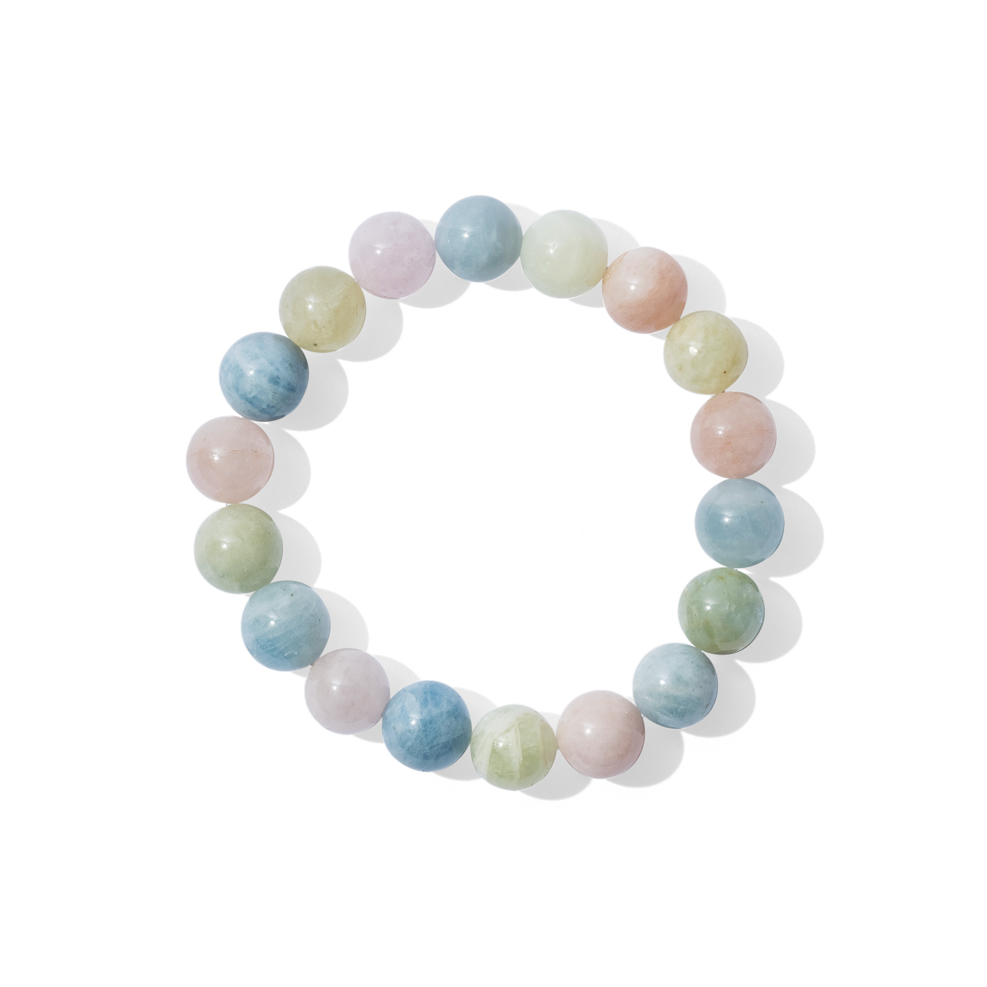 A single crystal gemstone bracelet made of morganite. A mixture of opaque, shiny pastel hues in pink, green, and blue.