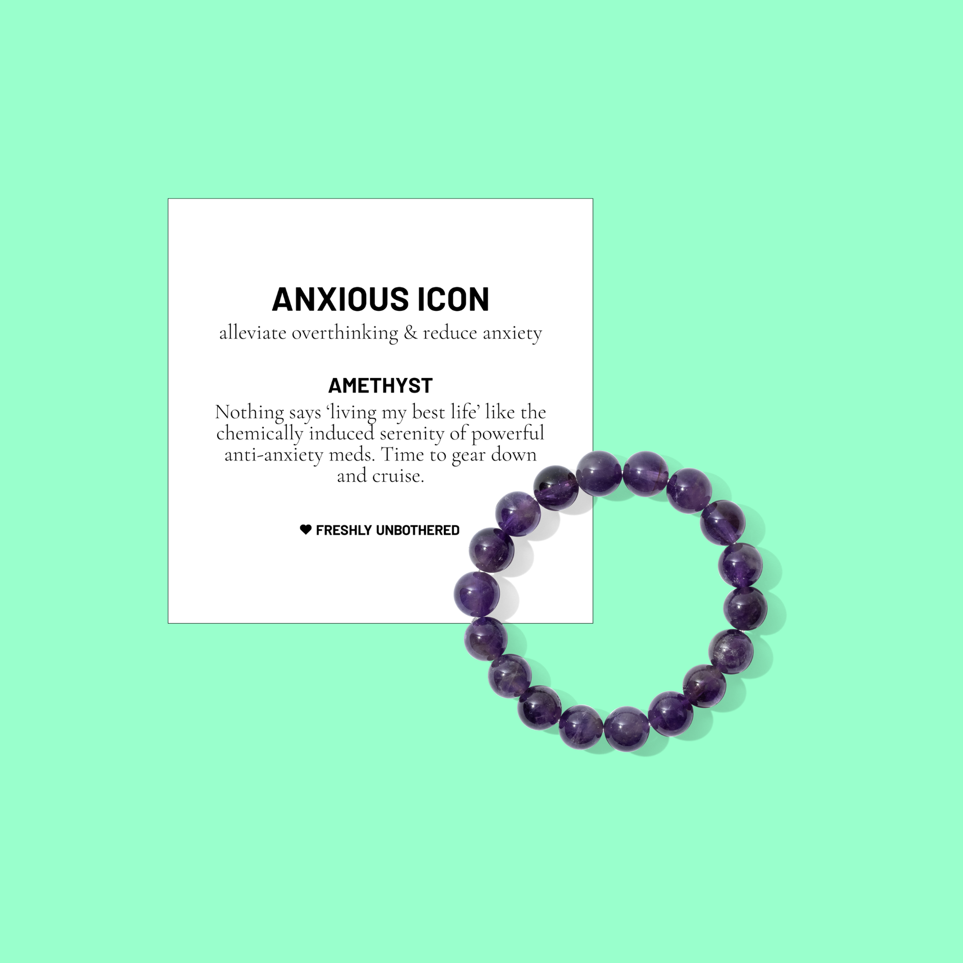 A green coloured background with a white card bearing the description of a crystal gemstone bracelet, and a round bead amethyst bracelet, positioned below and to the right of the card.