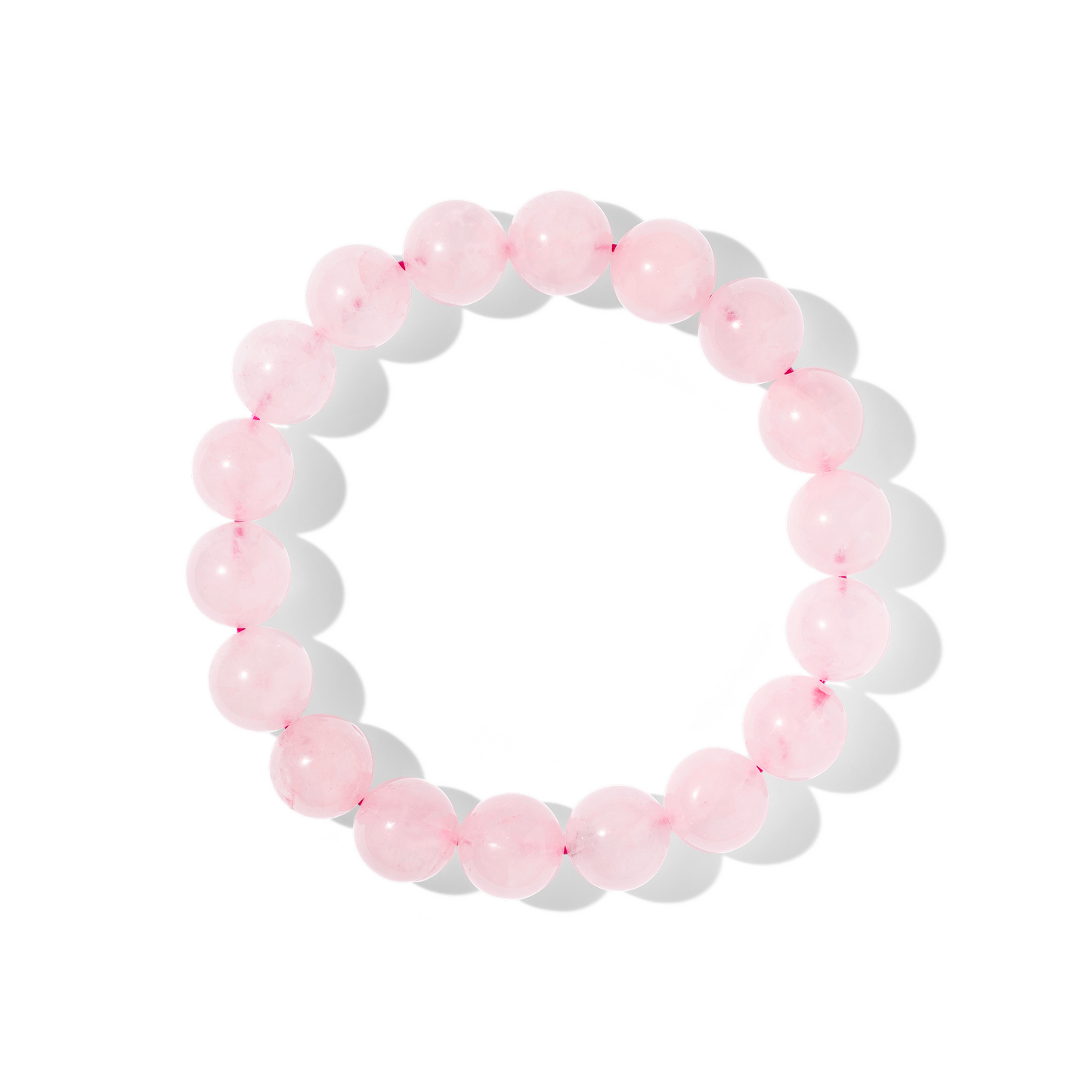 A single crystal gemstone bracelet made of rose quartz. A semi opaque, shiny delicate light pink.