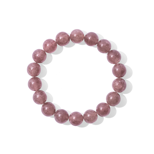 A single crystal gemstone bracelet made of strawberry quartz. A semi-transparent, shiny mid-toned pink.