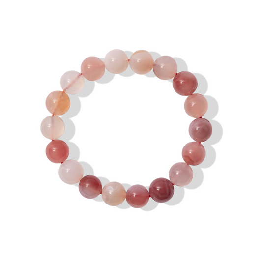 A single crystal gemstone bracelet made of Yanyuan candy agate. A semi opaque, shiny mixture of pink, white, and plum.